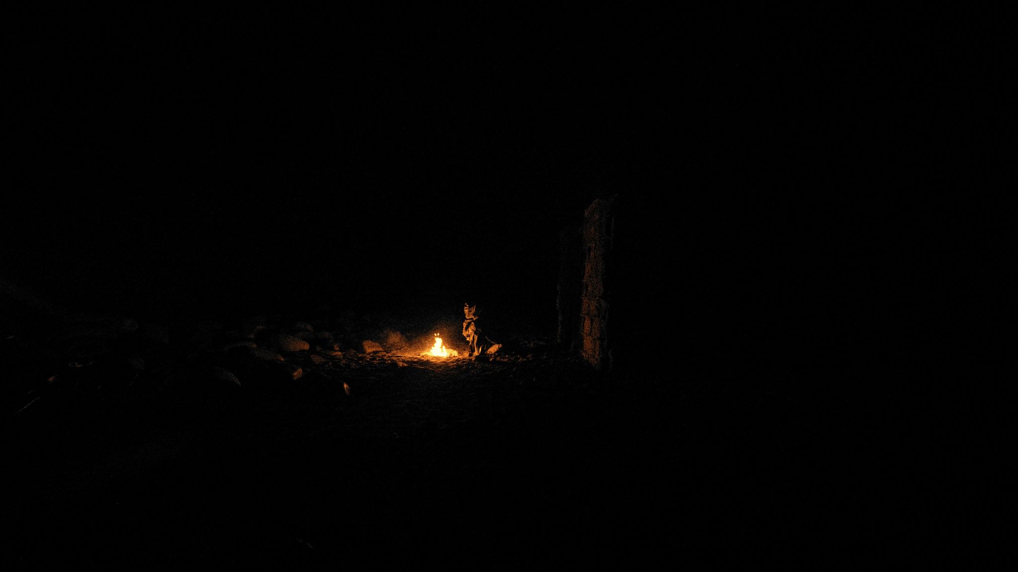 Wide of a nomad beside a fire